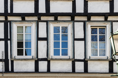 old half-timbered house facade with windows 