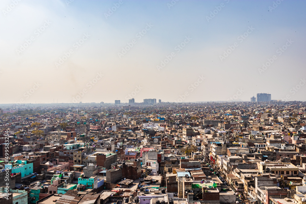 Obraz premium crowded city construction with flat hazy sky at morning from unique angle