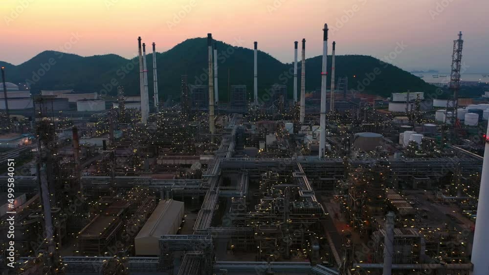 Aerial view of petrochemical oil refinery and sea in industrial engineering concept in Bangna district at night, Bangkok City, Thailand. Oil and gas tanks pipelines in industry. Modern metal factory.
Aerial view of petrochemical oil refinery and sea in industrial engineering concept in Bangna district at night, Bangkok City, Thailand. Oil and gas tanks pipelines in industry. Modern metal factory.