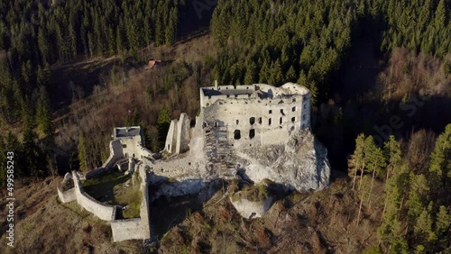 Medieval Abandoned Castle Of Hrad Likava On Mountain Top In Liptov, Slovakia. Aerial Drone Shot photo