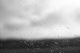 Raindrops on window glass with blur background