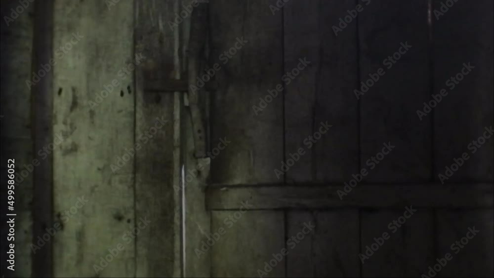 wooden walled rooms in an old house. Javanese ancient house with mystical nuances. spooky house rooms with alternating lights on and off.