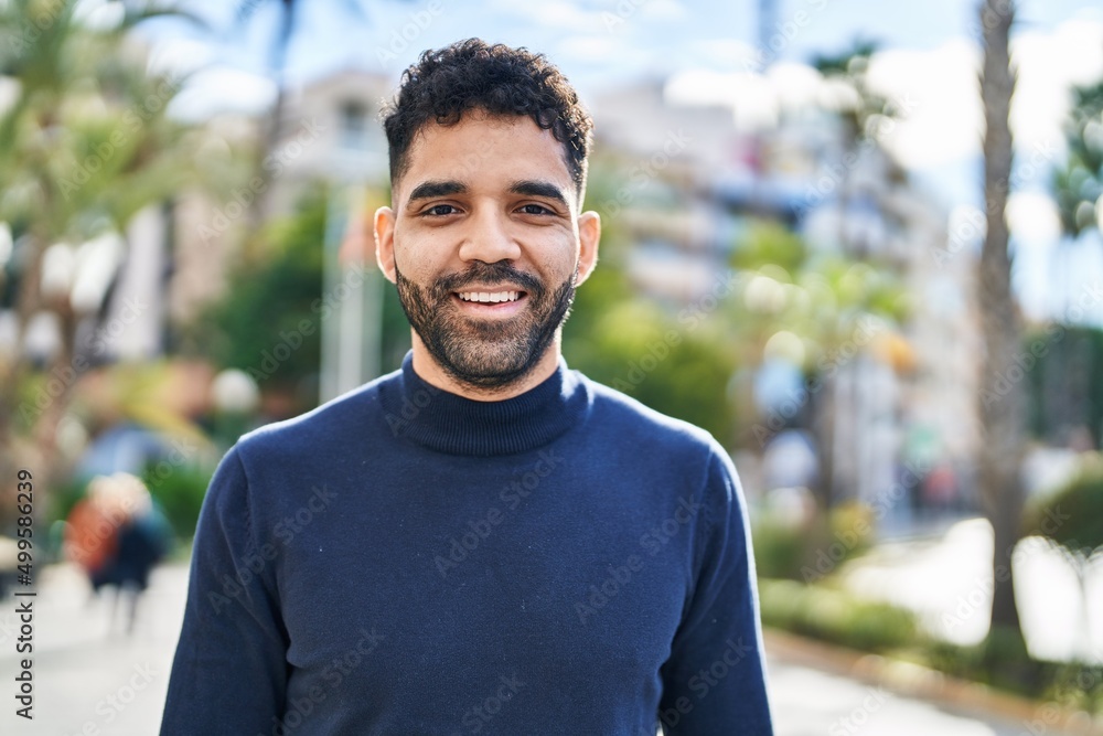 Young hispanic man smiling confident standing at street Young hispanic man smiling confident standing at street