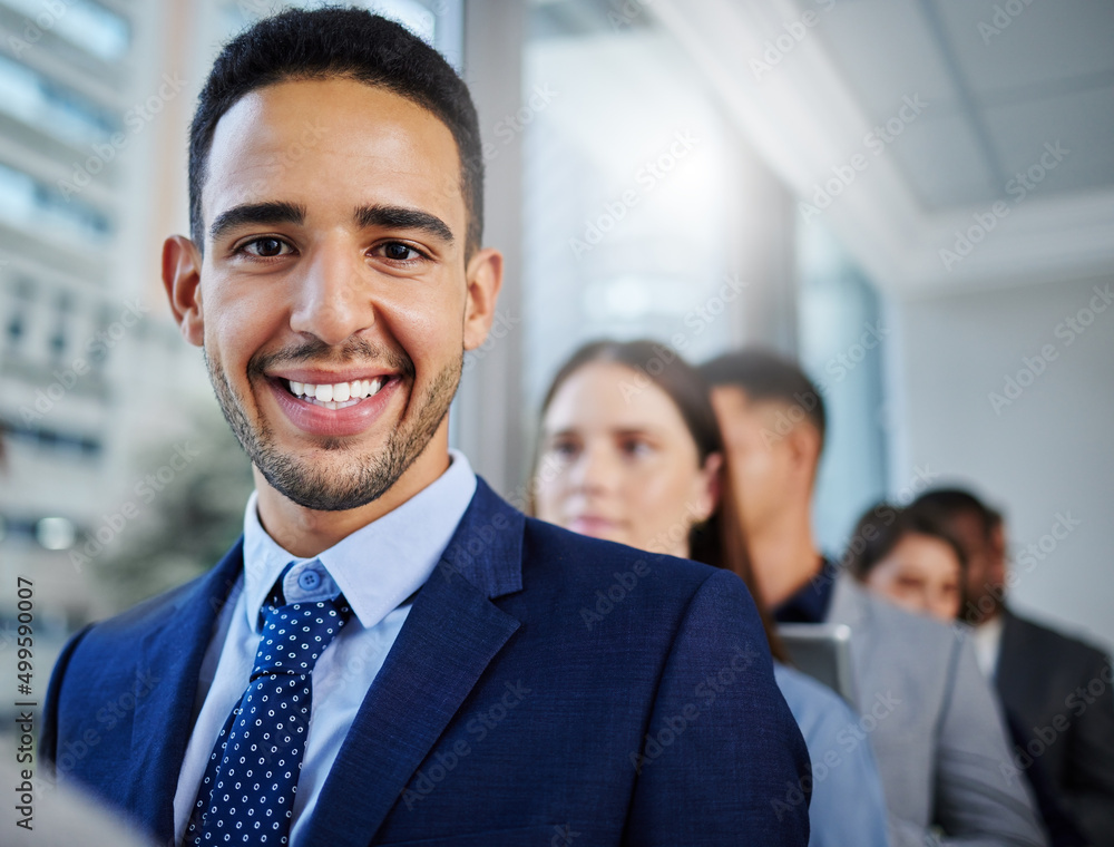 Looking forward to new beginnings. Shot of a young businesswoman standing in line in a modern office. Looking forward to new beginnings. Shot of a young businesswoman standing in line in a modern office.