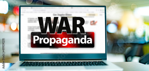 Laptop computer displaying the sign of 'WAR Propagada'