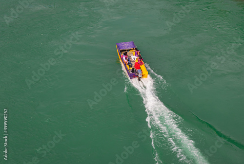 speed boat with trails at ganges river from top angle
