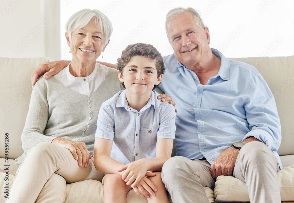 Our best days are together. Shot of a mature couple bonding with their grandson on the sofa at home. Our best days are together. Shot of a mature couple bonding with their grandson on the sofa at home.