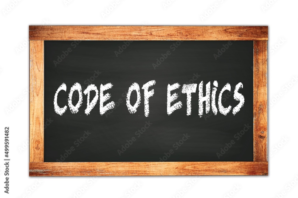 Fototapeta premium CODE OF ETHICS text written on wooden frame school blackboard.