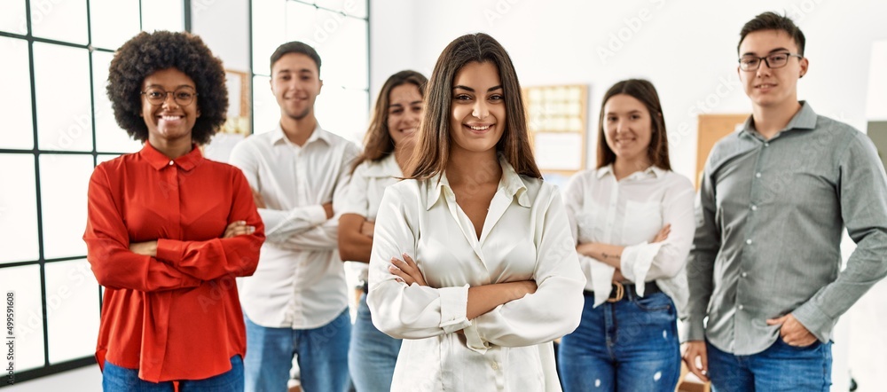 Group of business workers smiling happy standing with arms crossed gesture at the office.