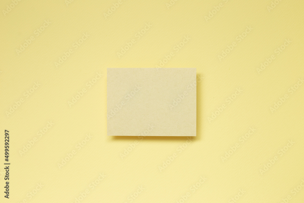 Yellow blank memo paper on yellow background. top view, copy space Yellow blank memo paper on yellow background. top view, copy space