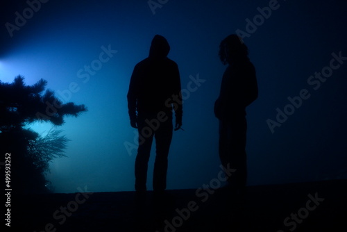 People in blue light 