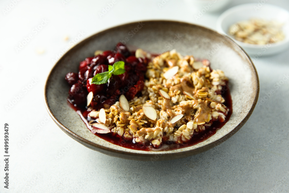 Healthy oatmeal porridge with cherries and almond Healthy oatmeal porridge with cherries and almond