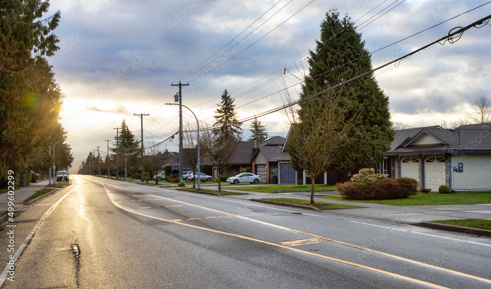 Fraser Heights, Surrey, Greater Vancouver, BC, Canada. Street view in the Residential Neighborhood during a colorful spring season. Colorful Sunrise Sky.