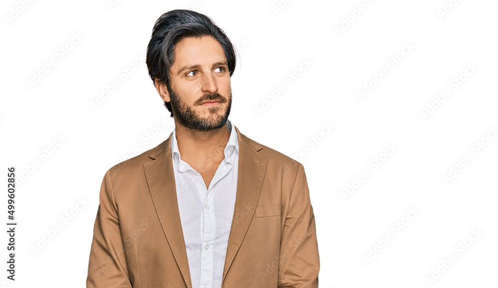 Young hispanic man wearing business clothes smiling looking to the side and staring away thinking. Young hispanic man wearing business clothes smiling looking to the side and staring away thinking.
