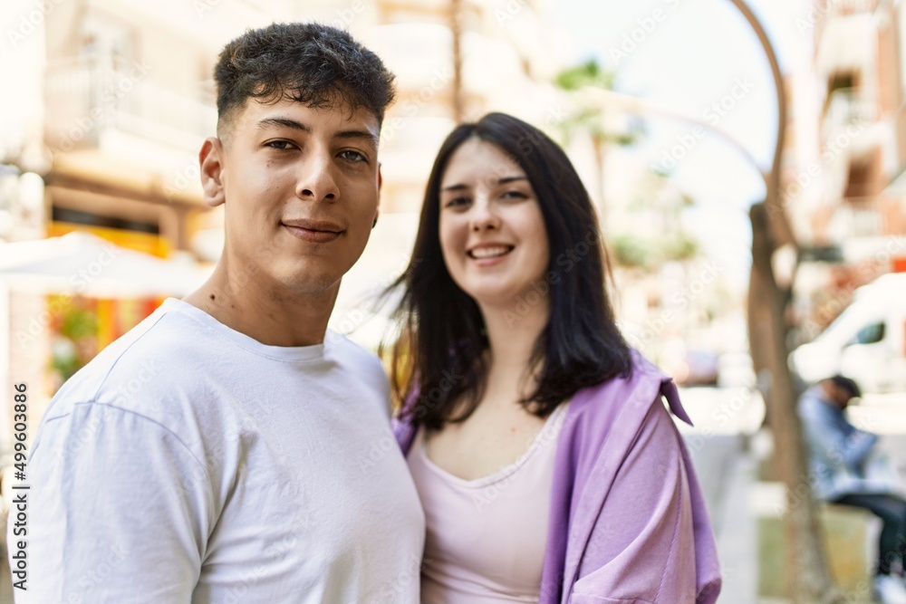 Young hispanic couple of boyfriend and girlfriend together outdoors on a sunny day Young hispanic couple of boyfriend and girlfriend together outdoors on a sunny day