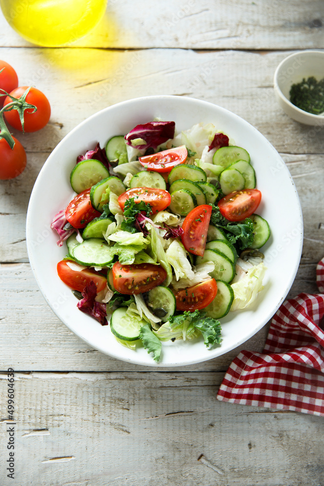 Healthy green salad with tomato and cucumber
