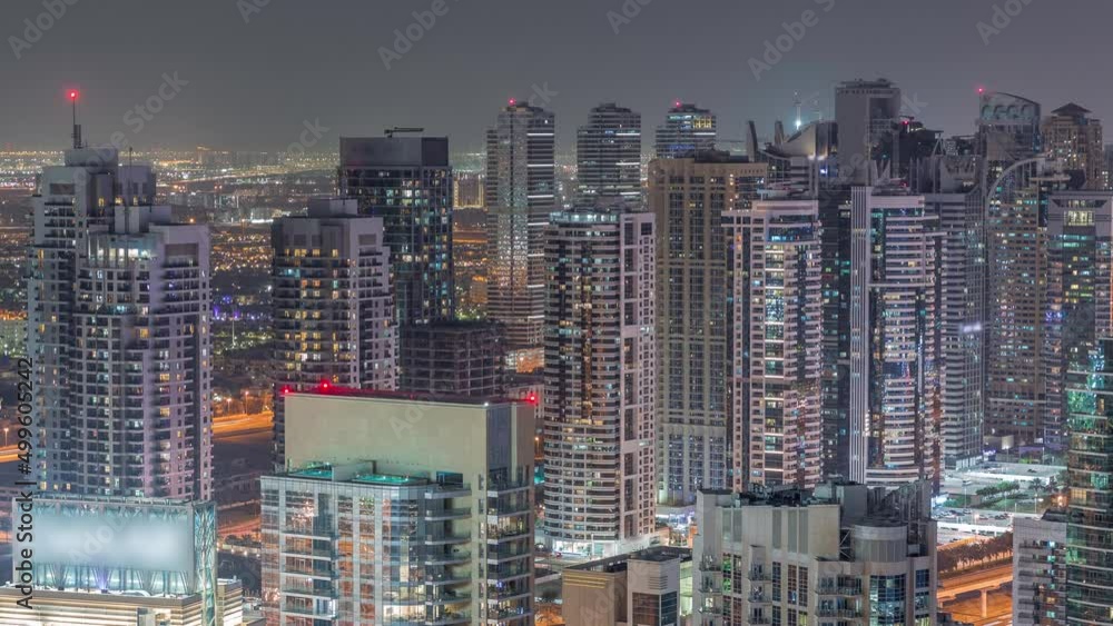 Dubai marina and JLT skyscrapers along Sheikh Zayed Road aerial night timelapse. Dubai marina and JLT skyscrapers along Sheikh Zayed Road aerial night timelapse.