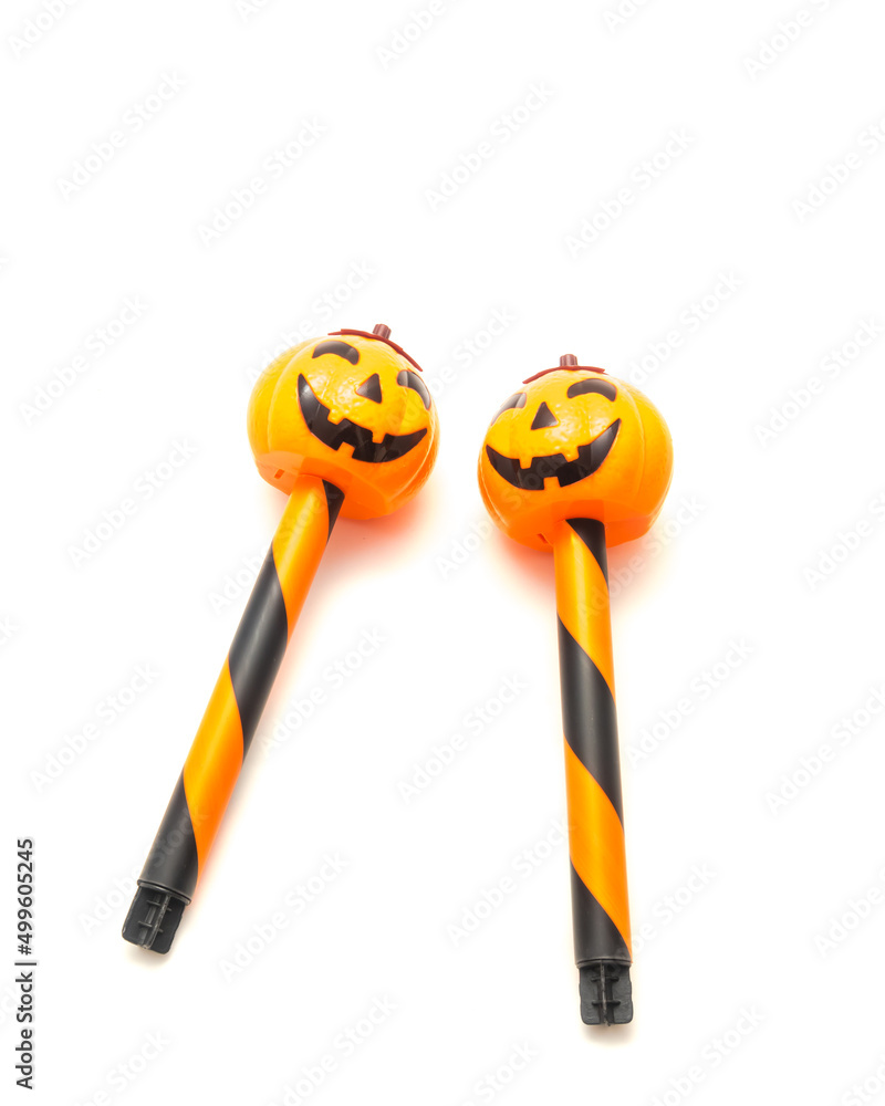 Fototapeta premium Two Halloween stake light with solar powered Jack O Lantern head garden path walkway light isolated on white