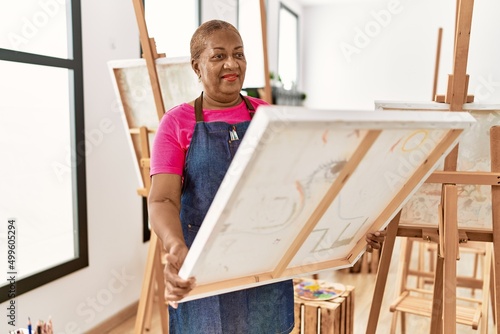 Senior african american woman smiling confident looking draw canvas at art studio