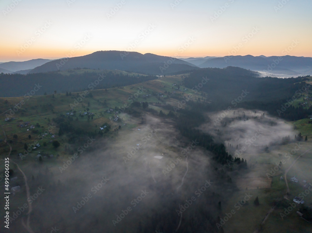 Morning fog in the Ukrainian Carpathians. Aerial drone view.