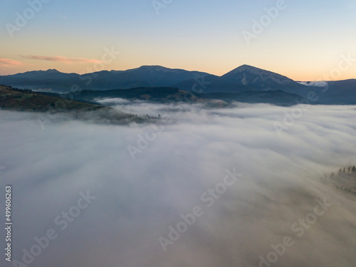 Morning fog in the Ukrainian Carpathians. Aerial drone view. © Sergey