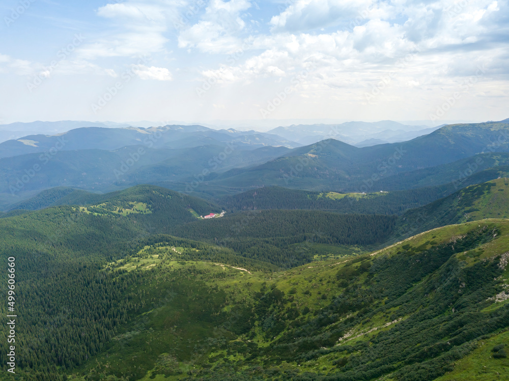 Fototapeta premium High mountains of the Ukrainian Carpathians in cloudy weather. Aerial drone view.