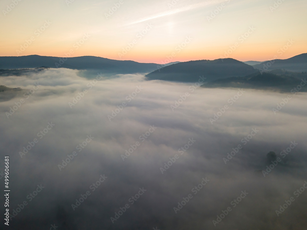 Morning fog in the Ukrainian Carpathians. Aerial drone view.