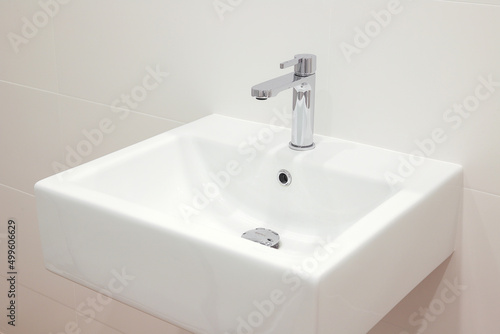 Modern white bathroom sink with faucet