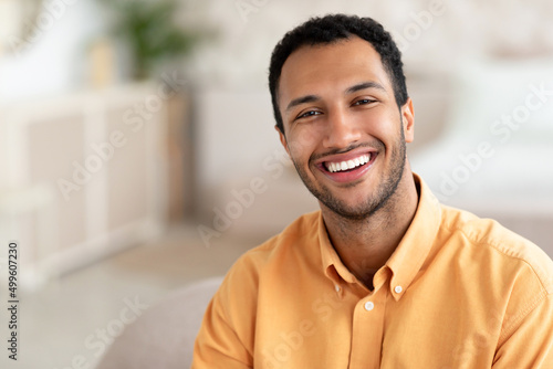 Portrait of smiling young man posing at camera