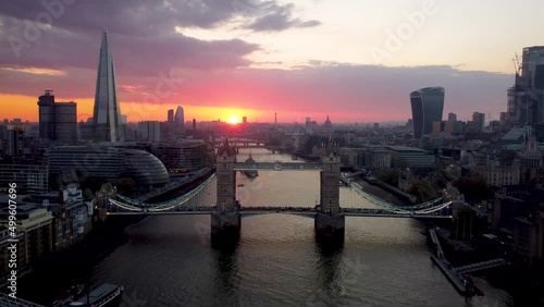 Aerial sunset view of the Tower Bridge of London with city skyline and river Thames, England photo