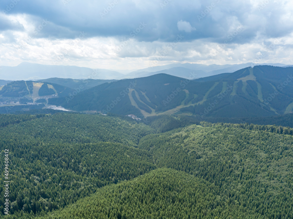 Green mountains of Ukrainian Carpathians in summer. Sunny day, rare clouds. Aerial drone view. Green mountains of Ukrainian Carpathians in summer. Sunny day, rare clouds. Aerial drone view.
