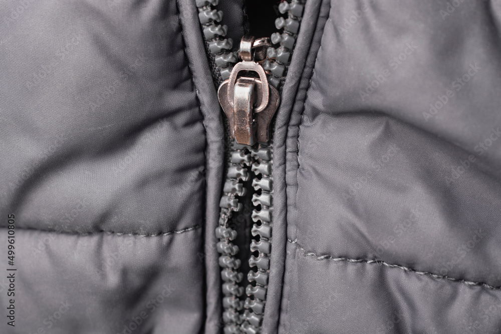 Close up of a broken zipper on a jacket. Stock Photo Adobe Stock