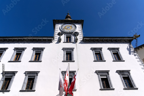 Medieval old town of City of Sion with historic city hall and flags on a sunny spring day. Photo taken April 4th  2022  Sion  Switzerland.