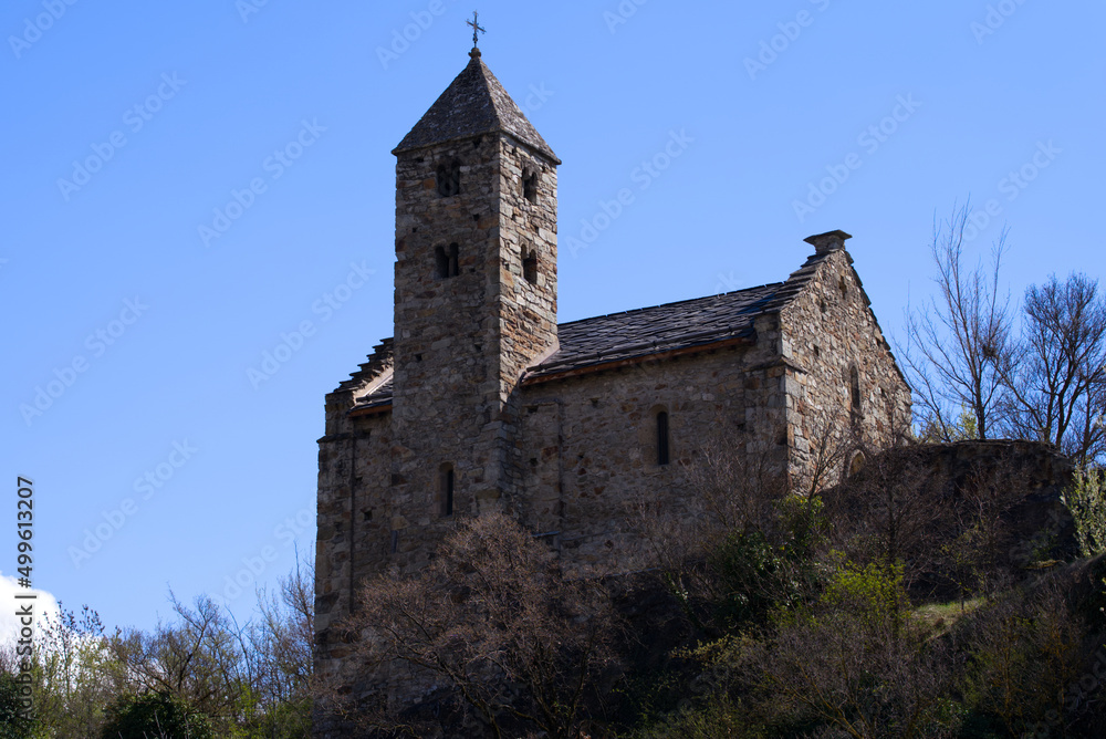 Beautiful medieval catholic chapel at castle Basilique de Valère (Valeria) on a hill at City of Sion on a sunny spring day. Photo taken April 4th, 2022, Sion, Switzerland.