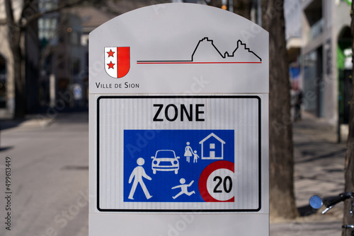Speed limit sign at residential area, speed restricted to maximum of 20 kilometers per hour at City of Sion on a sunny spring day. Photo taken April 4th, 2022, Sion, Switzerland.
