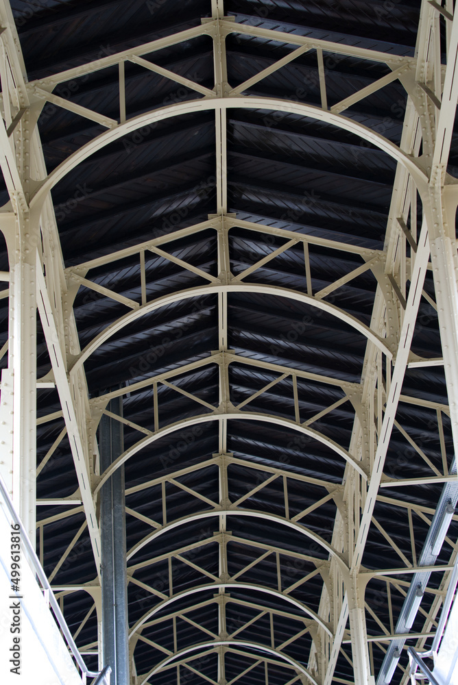 Roof of platform with arch construction at Vevey Railway station on a cloudy spring day. Photo taken April 4th, 2022, Vevey, Switzerland. Roof of platform with arch construction at Vevey Railway station on a cloudy spring day. Photo taken April 4th, 2022, Vevey, Switzerland.