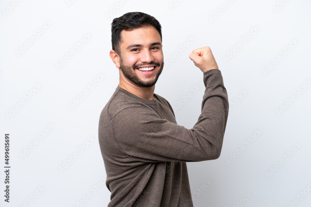 Young Brazilian man isolated on white background doing strong gesture