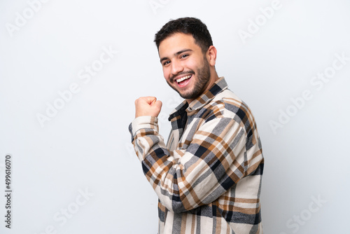 Photography Young Brazilian man isolated on white background celebrating a victory