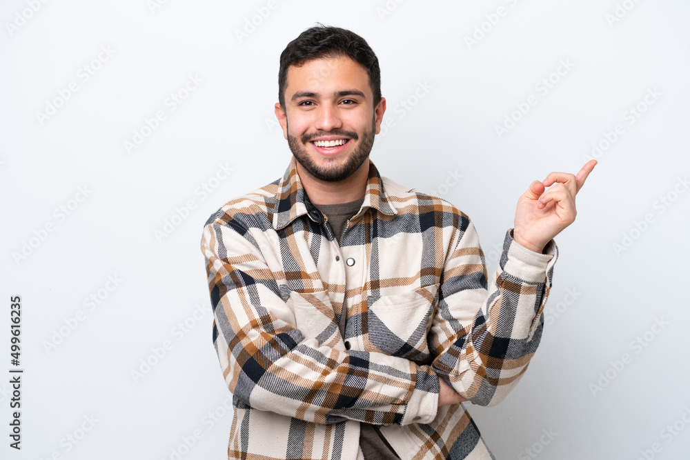 Young Brazilian man isolated on white background happy and pointing up Young Brazilian man isolated on white background happy and pointing up