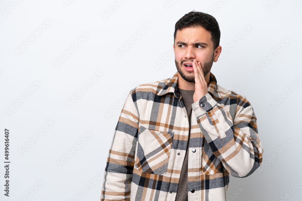 Young Brazilian man isolated on white background whispering something with surprise gesture while looking to the side Young Brazilian man isolated on white background whispering something with surprise gesture while looking to the side