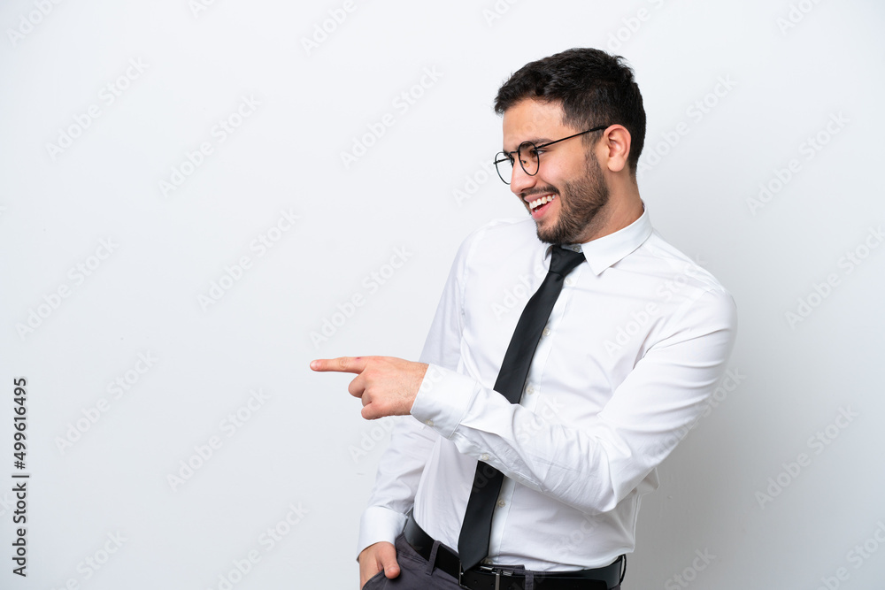 Business Brazilian man isolated on white background pointing finger to the side and presenting a product Business Brazilian man isolated on white background pointing finger to the side and presenting a product