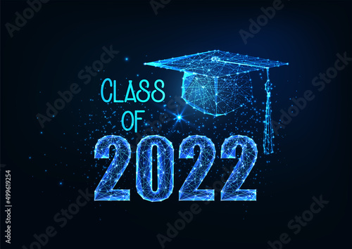 Futuristic graduation class of 2022 concept with glowing low polygonal graduation cap isolated on dark blue
