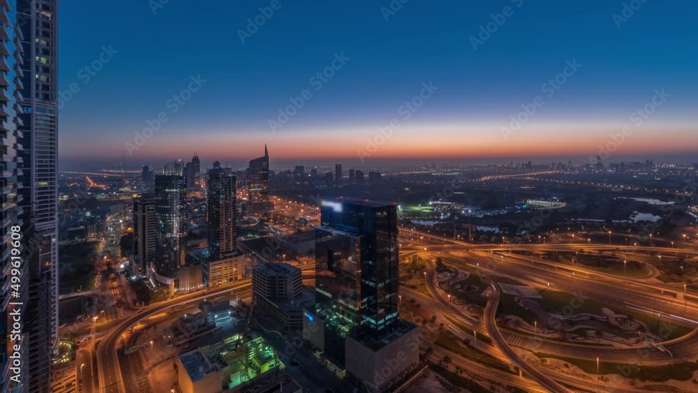 Aerial view of media city and al barsha heights district area night to day timelapse from Dubai marina. Aerial view of media city and al barsha heights district area night to day timelapse from Dubai marina.