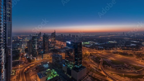 Wallpaper Mural Aerial view of media city and al barsha heights district area night to day timelapse from Dubai marina. Torontodigital.ca