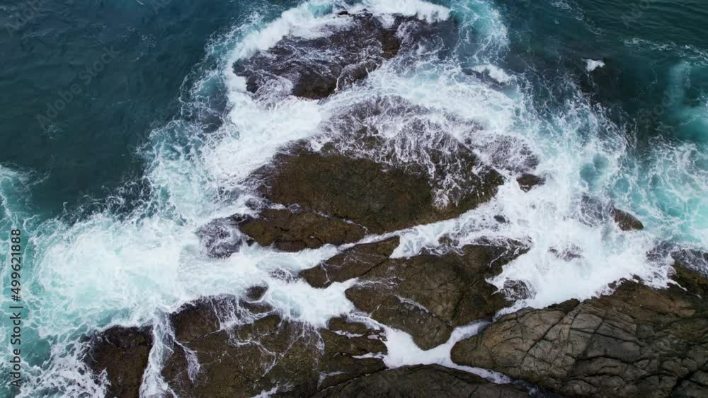 Aerial view Drone camera of seashore rocks in ocean. Beautiful dark sea surface. Amazing sea waves crashing on rocks seascape in Phuket island Thailand. Aerial view drone 4k High quality footage Aerial view Drone camera of seashore rocks in ocean. Beautiful dark sea surface. Amazing sea waves crashing on rocks seascape in Phuket island Thailand. Aerial view drone 4k High quality footage