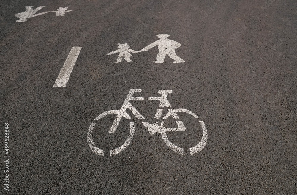 Road sign for cycle and pedestrians on the asphalt. White painted sign for for bicycles and pedestrians lane. Road sign for cycle and pedestrians on the asphalt. White painted sign for for bicycles and pedestrians lane.