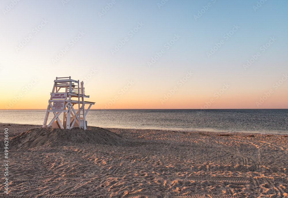 Lifeguard stand on an empty beach during sunset Lifeguard stand on an empty beach during sunset
