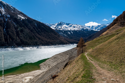 A wide view to the alps with a path in the foreground