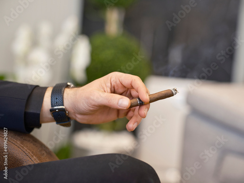 a man smoking a cuban cigar