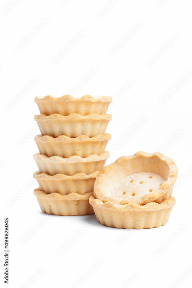 Stack of empty tartlets (tarts, tart shells) isolated on the white background Stack of empty tartlets (tarts, tart shells) isolated on the white background